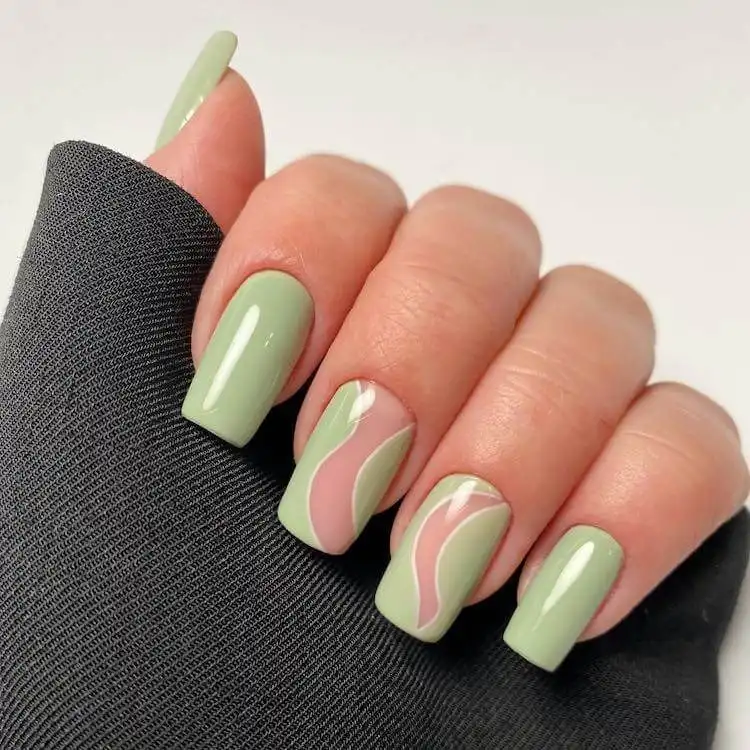 Funky retro-inspired tapered square nails with bold colors and vibrant swirling patterns.