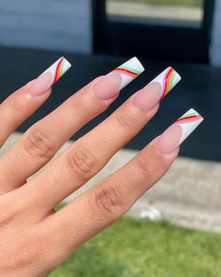 Tapered square nails with neon wavy lines over white French tips.