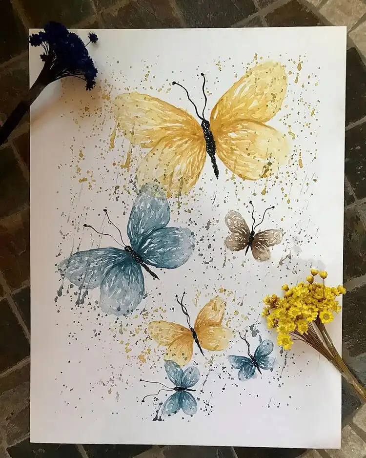 Collection of blue watercolor butterflies showcasing various shades and patterns for painting ideas.