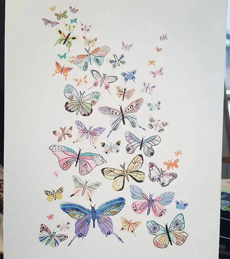 Joyful composition of many colorful watercolor butterflies fluttering together.