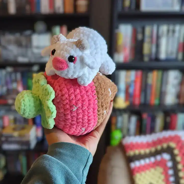 Henry the Highland Cow, a crochet plushie with shaggy brown fur and small horns, depicting the iconic Highland breed.