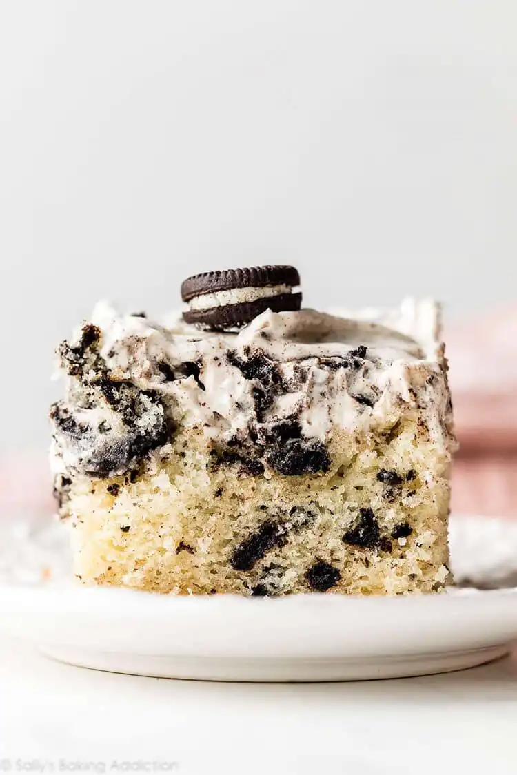 Cookies and cream sheet cake topped with crushed Oreo cookies