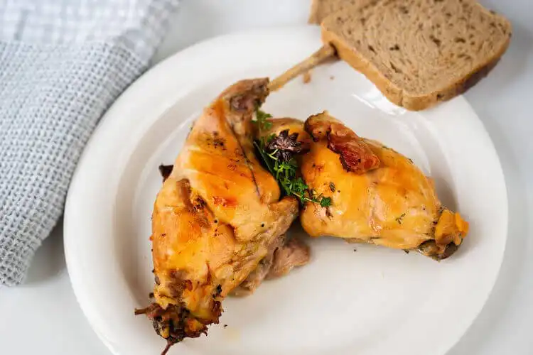 Braised squirrel with hazelnut jus on a plate, elegantly plated, a gourmet game dish