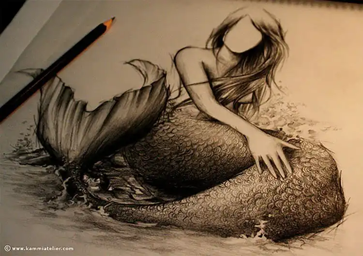Detailed pencil art of a graceful mermaid sketch with flowing tail and intricate shading.
