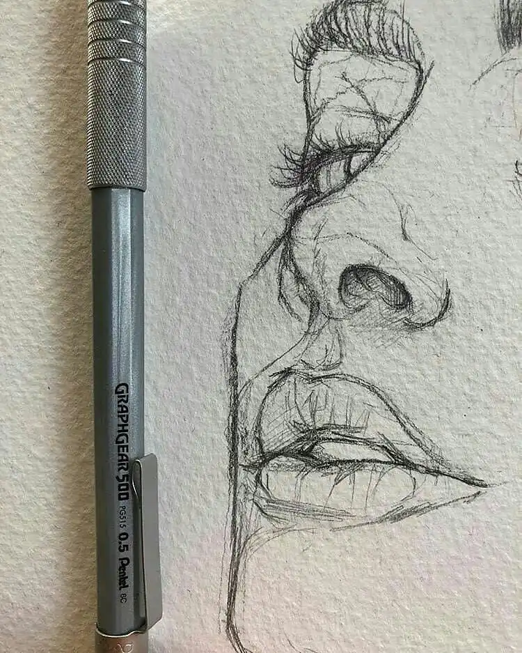 Dynamic quick sketch of a face, demonstrating initial lines and spontaneity in pencil art.