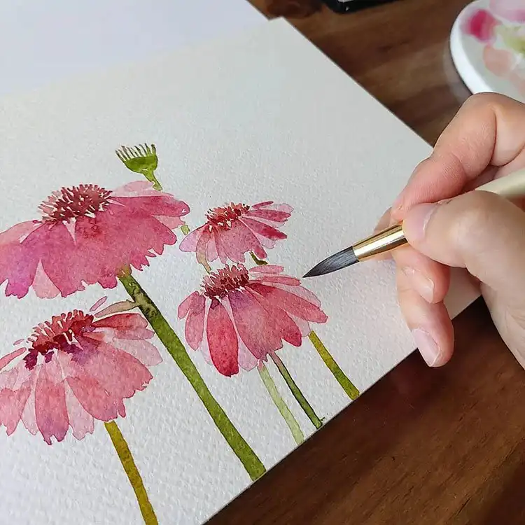A fun watercolor painting of a cactus in a pink pot with a small flower, ideal for quick creative projects.