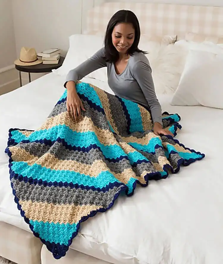 A simple Corner-to-Corner Throw in a serene solid color, highlighting the C2C stitch.