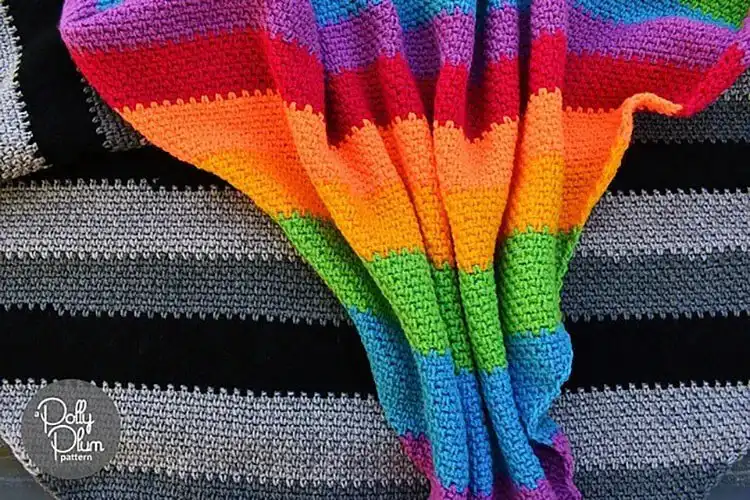 A colorful Scrappy Corner to Corner Baby Blanket made from various yarn scraps.