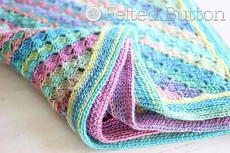 A close-up of a C2C Moss Stitch blanket, highlighting its dense, warm texture.