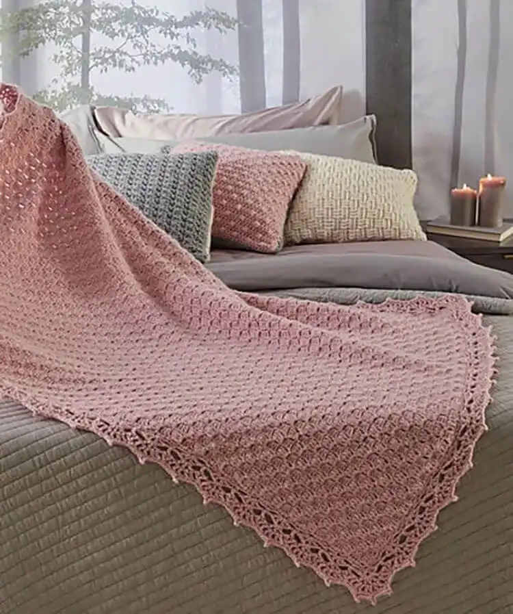 A soft Corner-to-Corner Cloud Blanket featuring a whimsical cloud design.