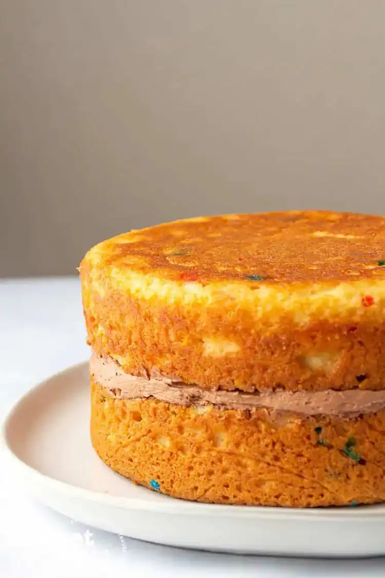 A bakery-style cake made from a box mix, showcasing professional presentation and texture.