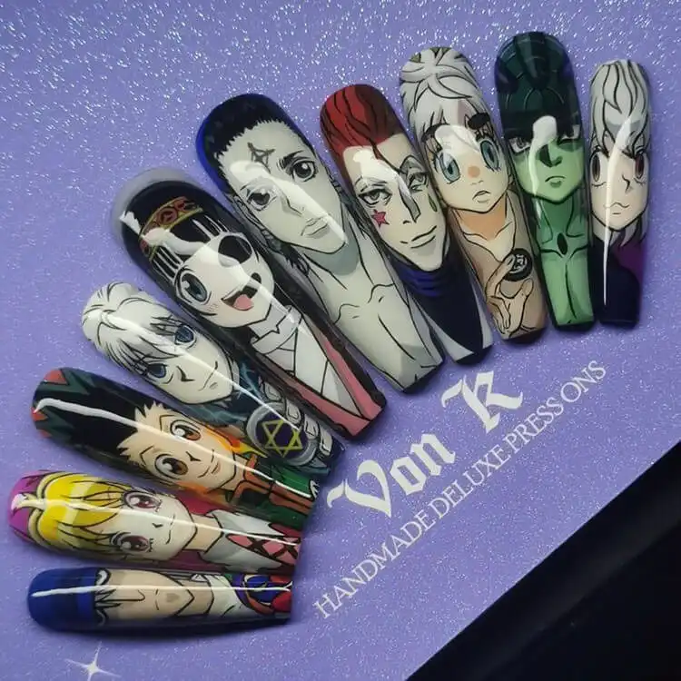 23 Anime Nail Designs to Show Your Love for Anime and Manga - Jujutsu Kaisen Sukuna 14 Purple nails depicting Hisoka from Hunter x Hunter, with star, tear, and playing card motifs.
