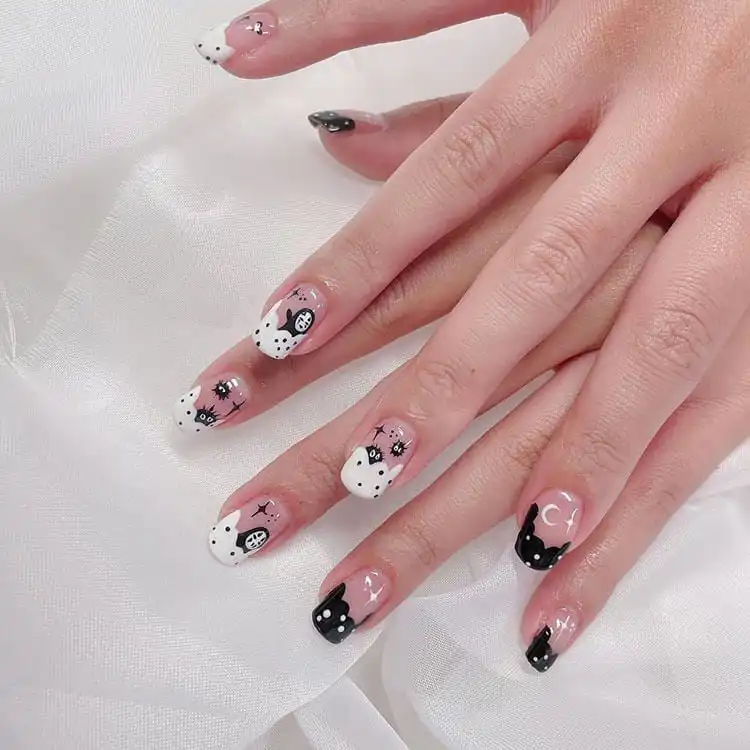 23 Anime Nail Designs to Show Your Love for Anime and Manga - Jujutsu Kaisen Sukuna 3 Whimsical Spirited Away themed square nails featuring No-Face and Soot Sprites with soft colors.