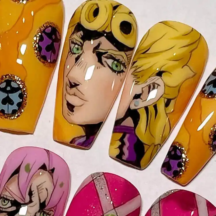 23 Anime Nail Designs to Show Your Love for Anime and Manga - Jujutsu Kaisen Sukuna 22 Zenitsu from Demon Slayer nails with dynamic yellow and orange lightning patterns, capturing his powers.