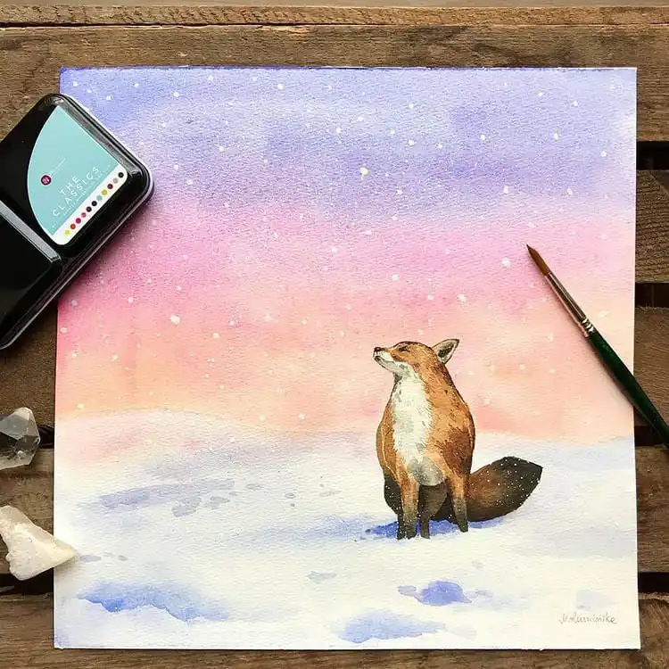 Beautiful watercolor painting of a fox in a serene snowy landscape, perfect for a thoughtful handmade gift.