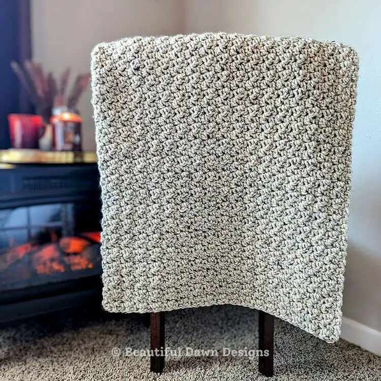 A cozy, chunky crochet throw blanket with a distinctive griddle stitch texture, named Fireside Throw