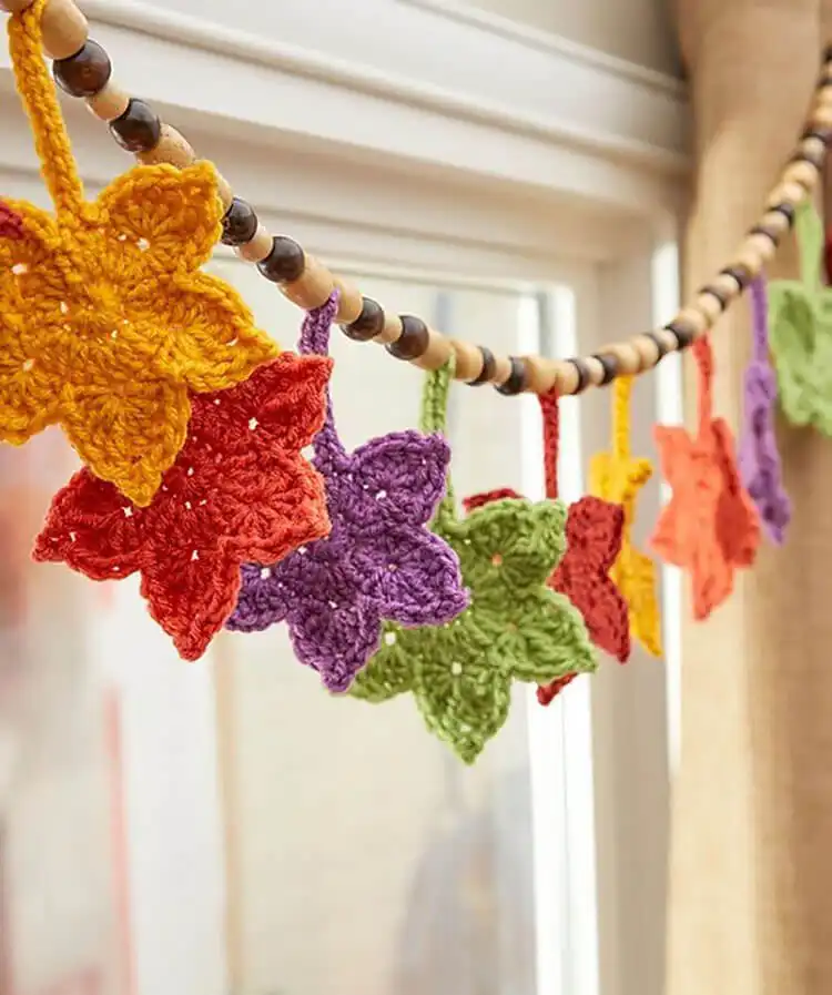 A decorative crochet banner composed of various fall-colored leaves, titled Fall Leafy Banner