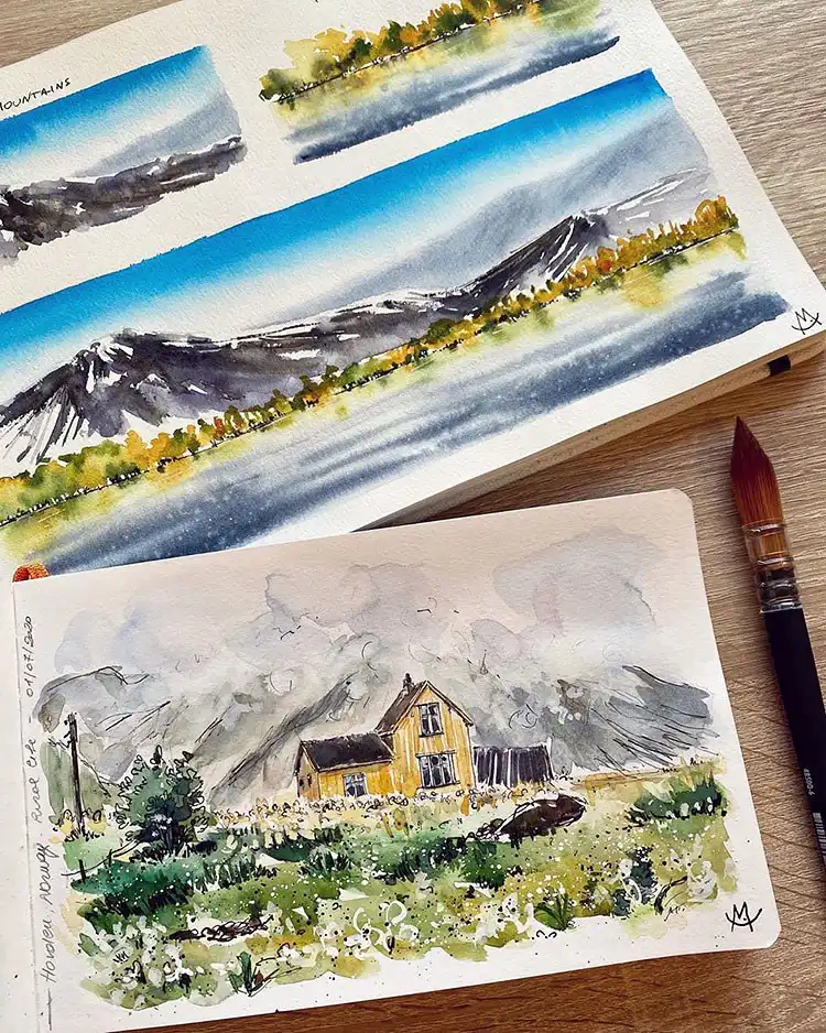 Watercolor painting of a house nestled in the wilderness with mountains in the background