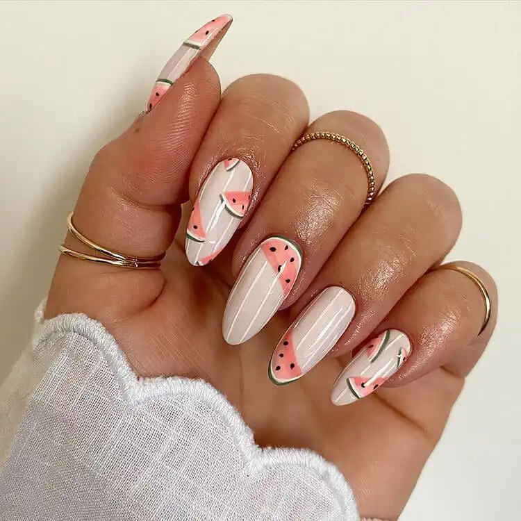 Playful watermelon-themed acrylic nails, capturing the fresh and juicy essence of summer fruit.