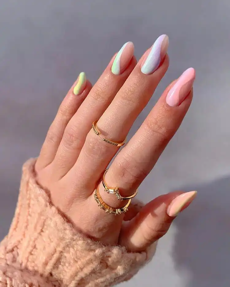 Simple pastel pink, blue, and green acrylic nails in an almond shape, highlighting a clean and elegant style.