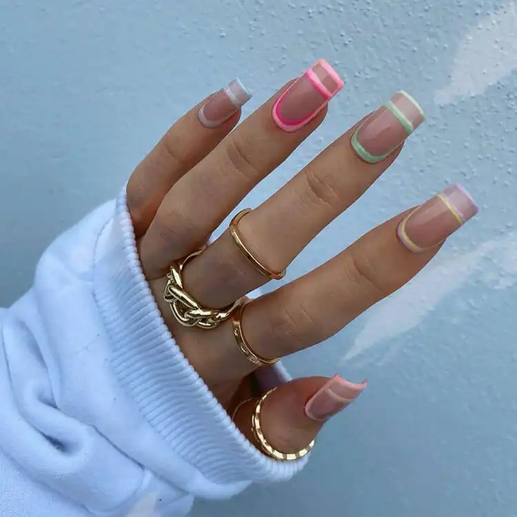 Unique and creative acrylic nails with abstract black lines and negative space, offering a distinct artistic expression.