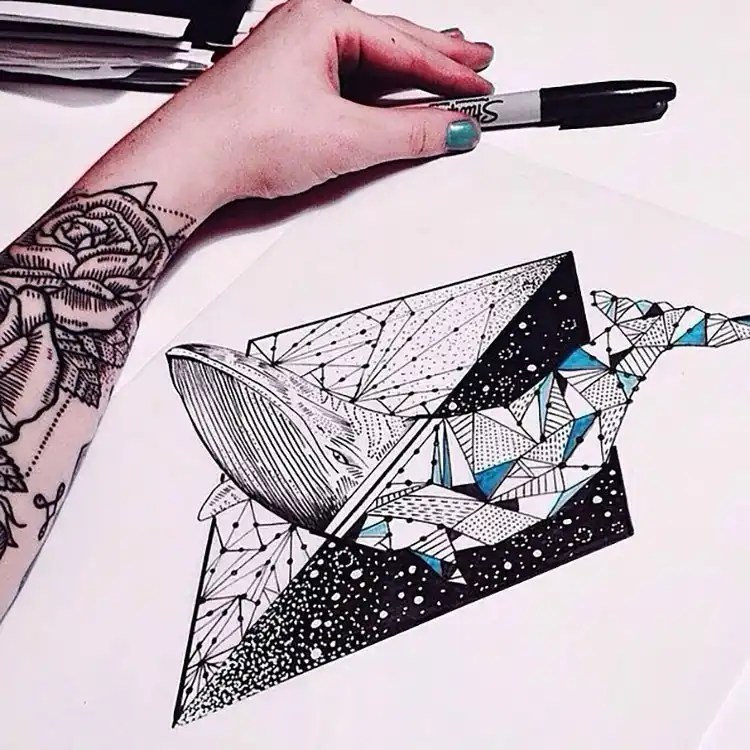 Beautiful drawing of a whale in black, white, and blue, highlighting artistic contrast.