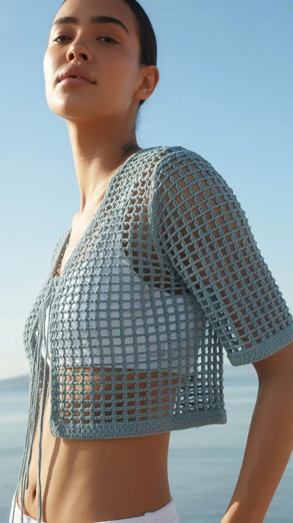 Example of a beginner lace shrug, demonstrating its open mesh stitch and how it can be easily converted to a lace-up bolero.