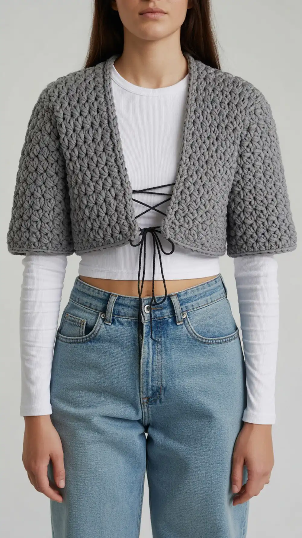 A fast chunky bolero crocheted with a basket-weave texture, styled for a Y2K look with contrasting lace-up details.
