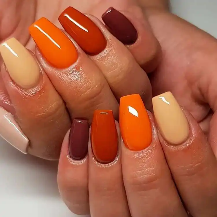 Acrylic Fall Coffin Nails with Orange and Brown Polish with Glitter 13 Colorful Fall Acrylic Coffin Nails, simple yet striking with diverse autumn hues on each nail
