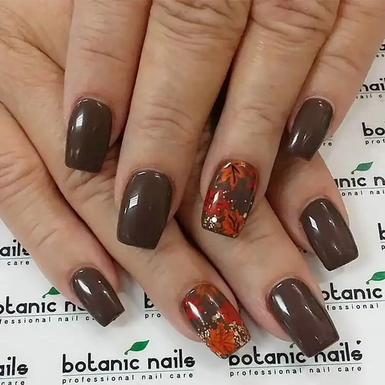 Acrylic Fall Coffin Nails with Orange and Brown Polish with Glitter 17 Brown Acrylic Coffin Nails with Orange Leaves, an elegant design that captures the warmth of autumn