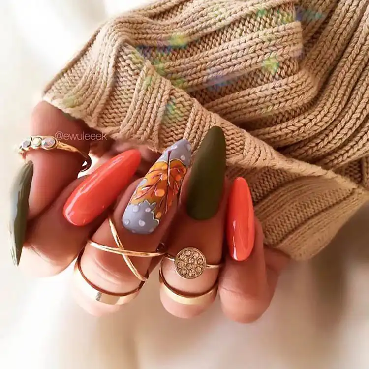 Acrylic Fall Coffin Nails with Orange and Brown Polish with Glitter 21 Patchwork Acrylic Coffin Nails with a Scarecrow Theme, a fun and unique design for fall and Halloween