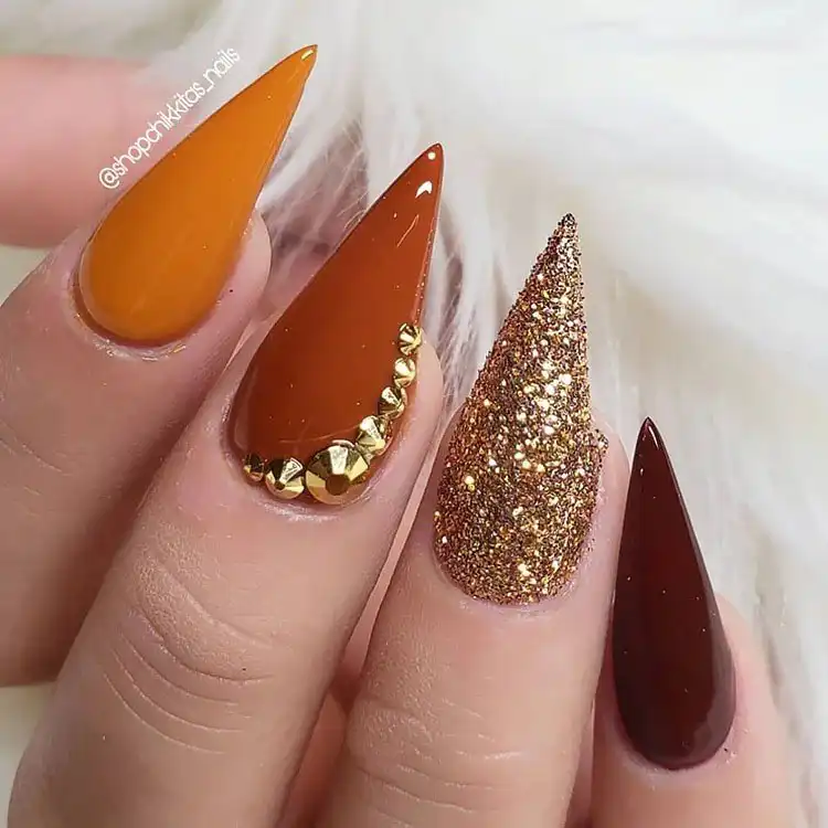 Acrylic Fall Coffin Nails with Orange and Brown Polish with Glitter 25 Orange and Brown Shimmer Acrylic Coffin Nails with Leaf Accents, featuring a beautiful sparkly polish for fall