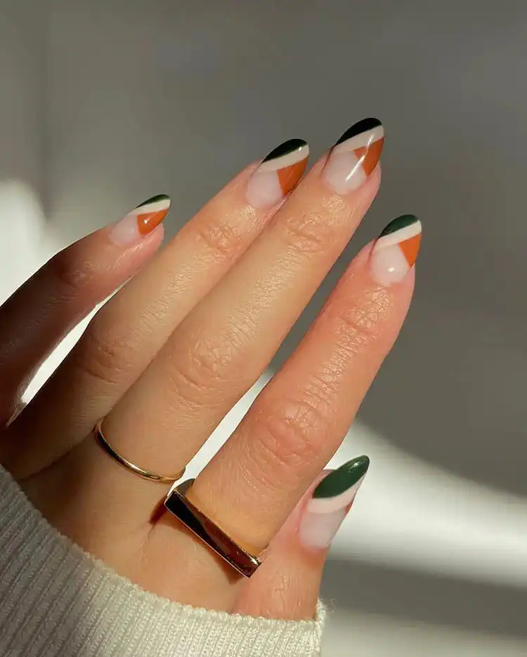 Acrylic Fall Coffin Nails with Orange and Brown Polish with Glitter 6 Fall Colorblock Acrylic Coffin Nails featuring rusty orange and green, creating a bold, contrasting design