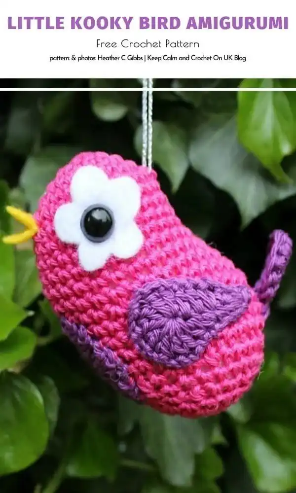A vibrant, multi-colored 'Little Kooky Bird Amigurumi' with unique flower-shaped eyes, sitting playfully.