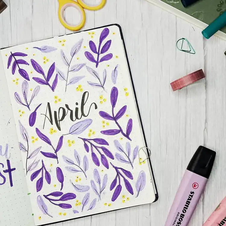 A simple April bullet journal cover page filled with light and dark purple leaves and small yellow accents.