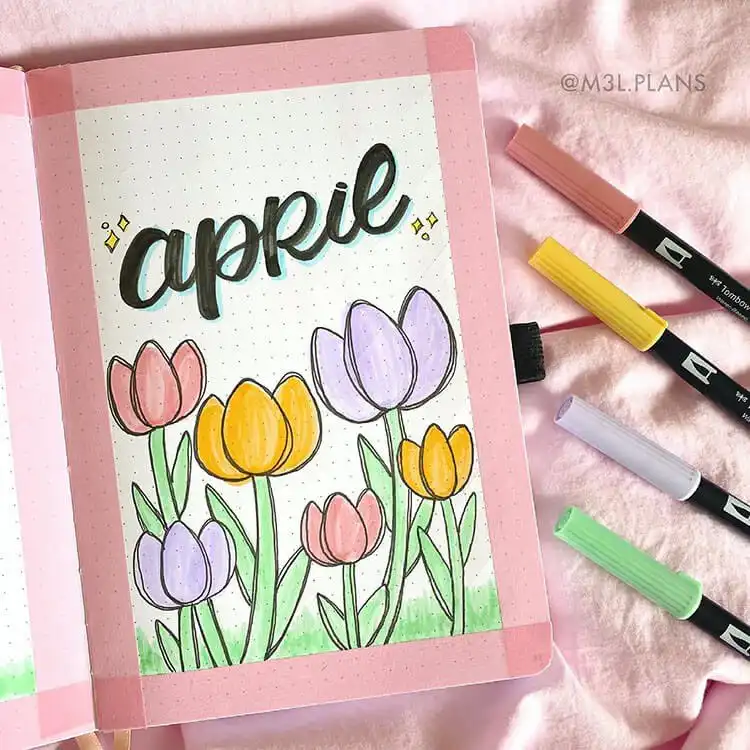 A colorful April bullet journal cover page adorned with bright tulips in various shades, perfect for spring.