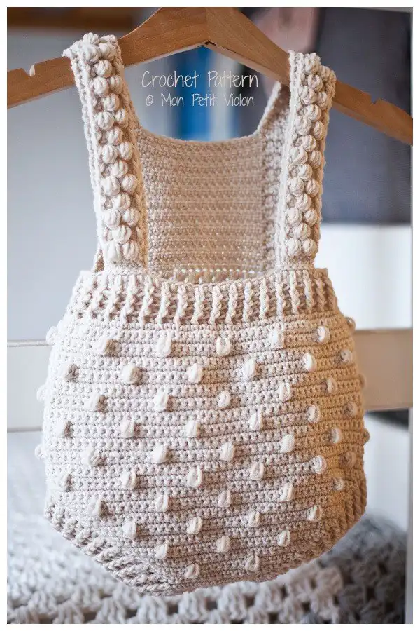 Textured Bobble Romper in a soft cream, with tactile bobble stitches throughout, from Baby Romper Free Crochet Patterns & Paid - DIY Magazine