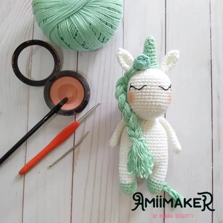 Magical Unicorn Amora amigurumi crochet with vibrant, braided mane.