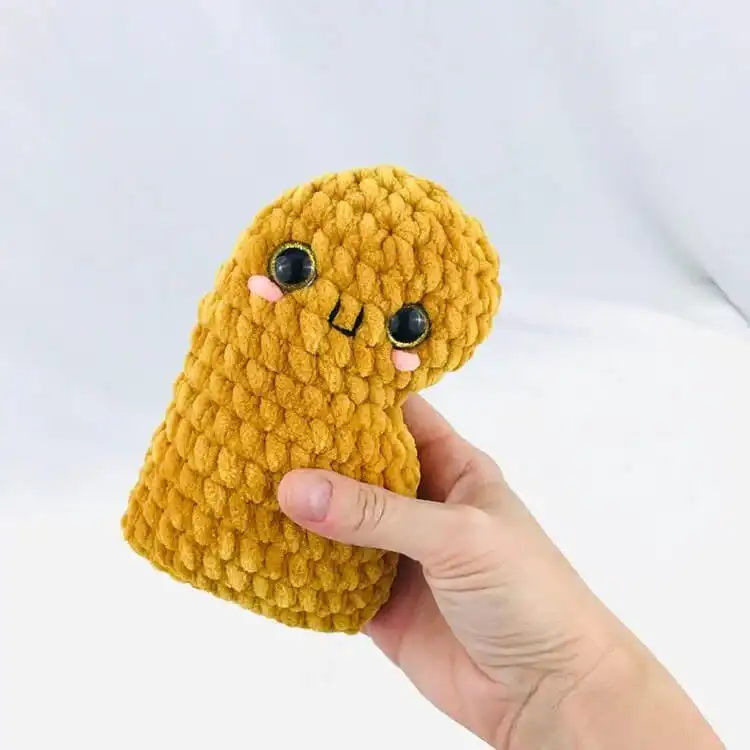 Adorable crochet Chicken Nugget amigurumi, a unique and fun plushie project.