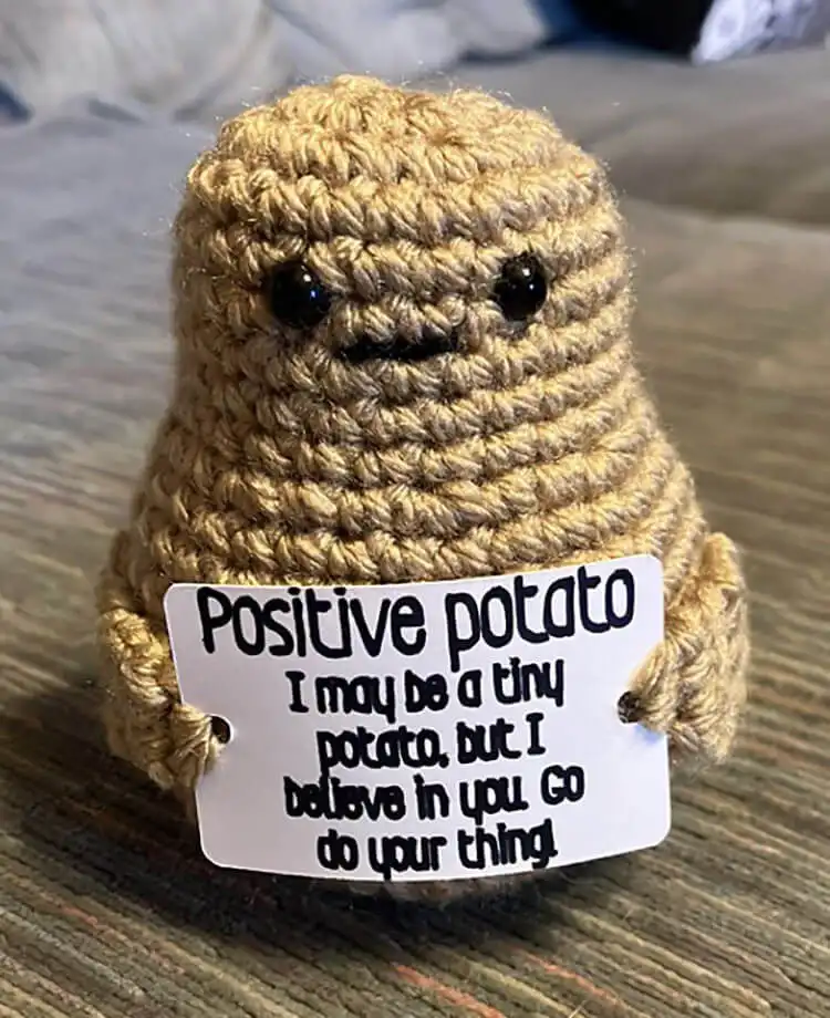Cheerful Positive Potato amigurumi crochet plushie, designed to spread happiness.