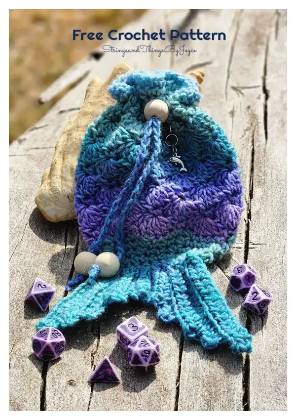 Enchanting Mermaid Tail Dice Bag Free Crochet Pattern, showcasing a beautiful scale texture and a delicate fin detail for oceanic fantasy.