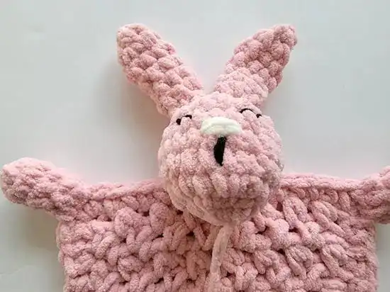Beginner-Friendly Free Bunny Lovey Crochet Pattern Baby Gift 11 Crochet bunny head positioned on the rectangular body, showing ideal placement before final sewing.