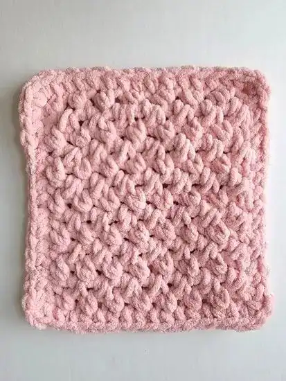 Beginner-Friendly Free Bunny Lovey Crochet Pattern Baby Gift 10 Finished pink rectangular body of the bunny lovey, showcasing the textured crochet stitch pattern.