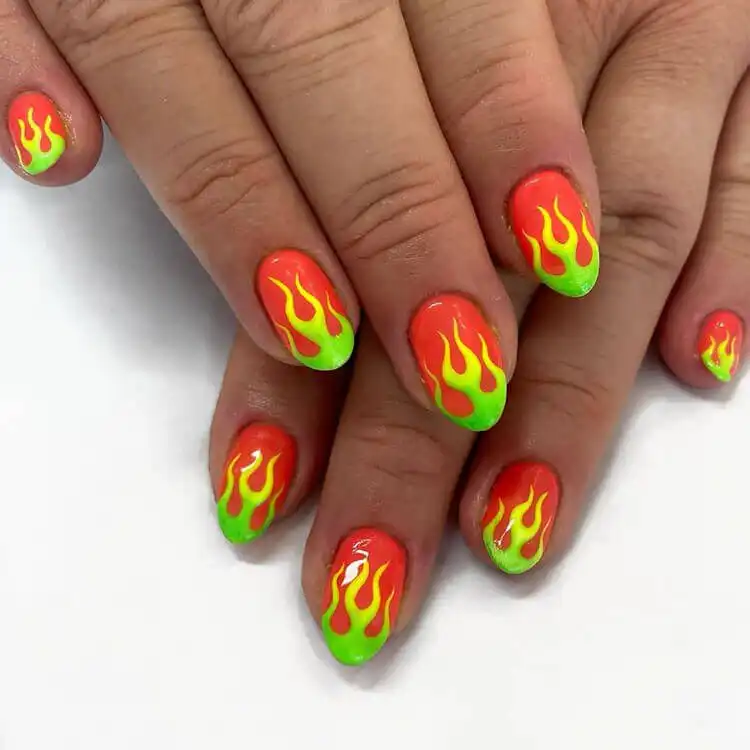 Black Nail Designs - Black Flames and Checkerboard 17 Clean and edgy white flame designs on nails, a modern twist on the French tip.