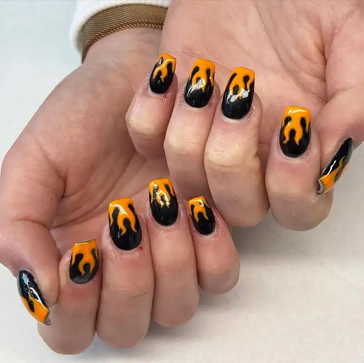 Black Nail Designs - Black Flames and Checkerboard 18 Stunning nail art combining red, green, and yellow for a vibrant and playful flame design.