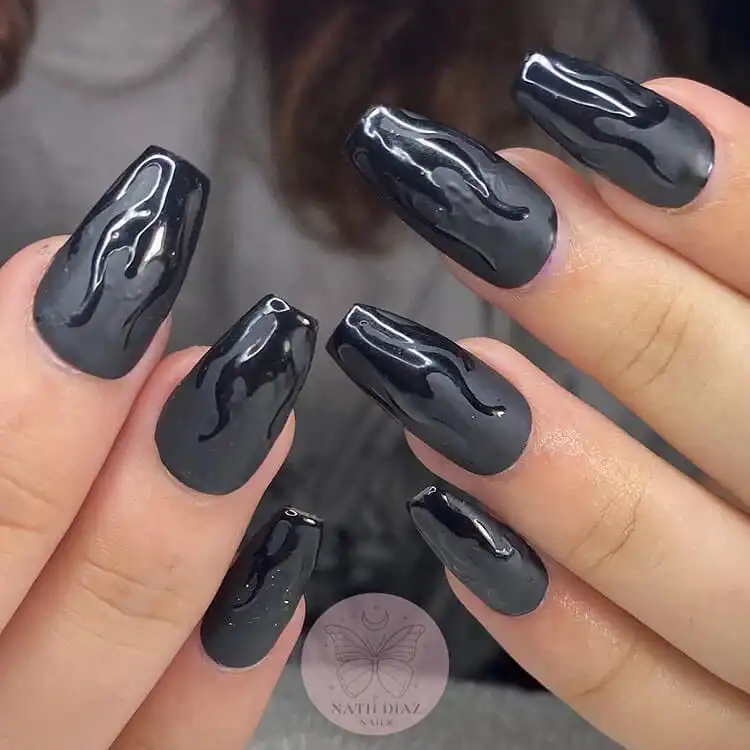 Black Nail Designs - Black Flames and Checkerboard 4 Matte black nails with glossy black flame patterns, showcasing a sophisticated textural contrast.