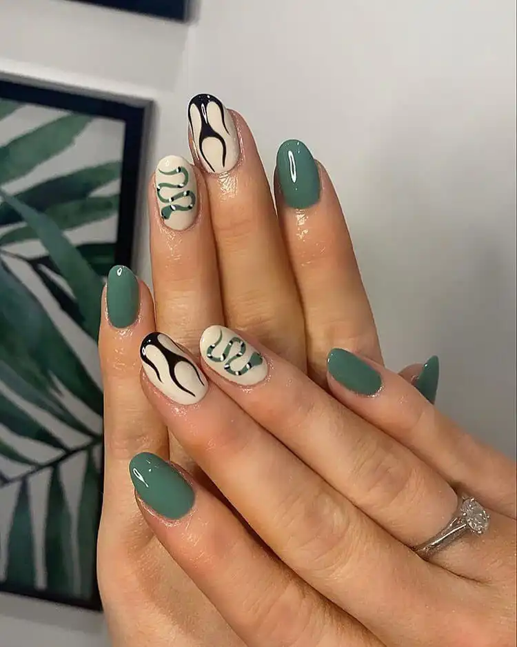 Black Nail Designs - Black Flames and Checkerboard 5 Unique nail art combining vibrant green snake motifs with sharp black flame designs.