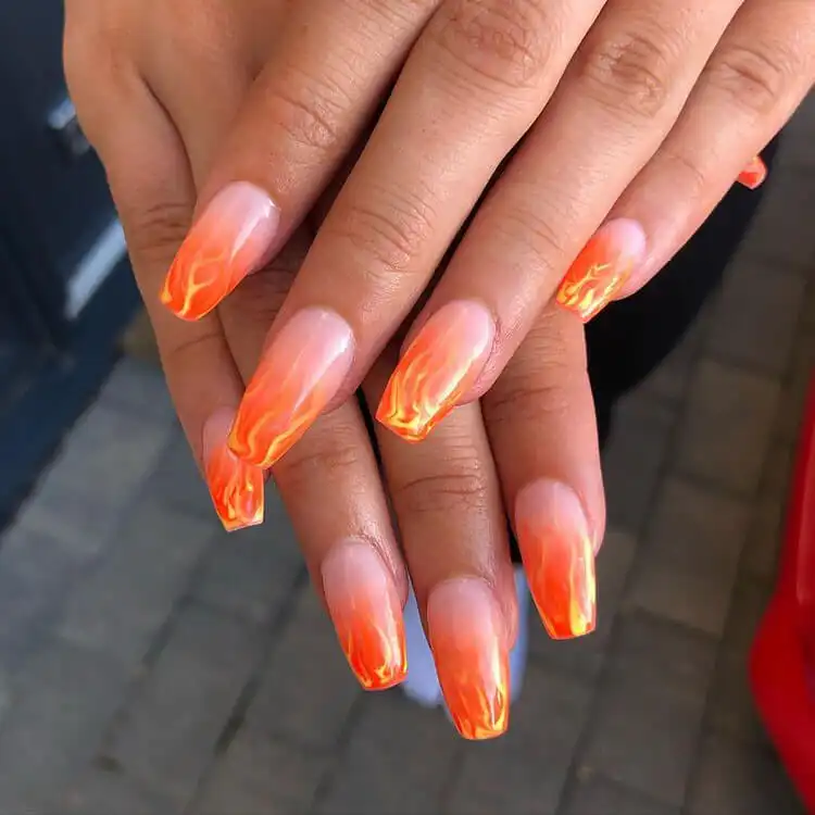 Black Nail Designs - Black Flames and Checkerboard 7 Realistic orange flame nails with an ombre effect, mimicking flickering fire.