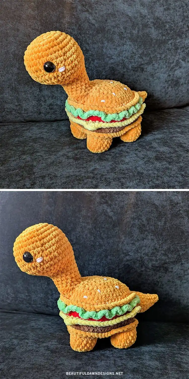 Humorous crochet Brent the Burgersaurus, a dinosaur character creatively designed to resemble a hamburger, with bun-colored head and tail.