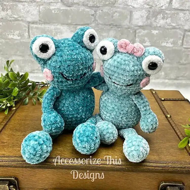 Small, friendly green crochet Pocket Pal Frog amigurumi with smiling mouth and large eyes